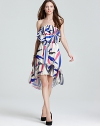 Vibrant florals and femme ruffles give this Sweet Pea dress a pop of personality just in time for summer's party season. Vibrant florals and femme ruffles give this Sweet Pea dress a pop of personality just in time for summer's party season.