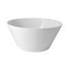 A striking bowl in pure white porcelain makes an elegant nest for your colorful salads and, with its clean, simple design and subtle pattern, it complements your table setting seamlessly.