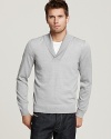 A dynamic layering piece for cold weather, this soft wool sweater is set apart by a deep V neck shawl collar.