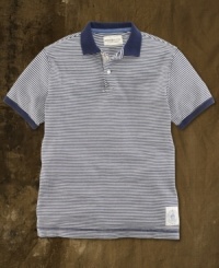 A preppy polo is transformed with weathered stripes and naval-inspired graphics for a vintage-inspired look that is ruggedly hip. A preppy polo is transformed with weathered stripes and naval-inspired graphics for a vintage-inspired look that is ruggedly hip.