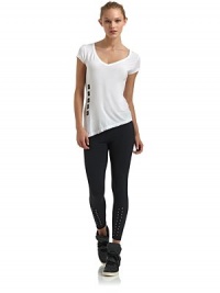 THE LOOKV-neckCap sleevesTiered neckline, cuffs and hemContrast grosgrain squares with grommetsAsymmetrical hem with side ventTHE FITAbout 22 from shoulder to hemTHE MATERIALMicromodal/spandexCARE & ORIGINMachine washImportedModel shown is 5'8 (172½cm) wearing US size Small. THE LOOKV-neckCap sleevesTiered neckline, cuffs and hemContrast grosgrain squares with grommetsAsymmetrical hem with side ventTHE FITAbout 22 from shoulder to hemTHE MATERIALMicromodal/spandexCARE & ORIGINMachine washImportedModel shown is 5'8 (172½cm) wearing US size Small.