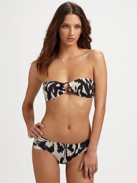 This retro-style bikini will make a splash, with center ring detail and ruched bottoms. Padded bandeau top with center ringBack tieRemovable strapsSide ruching on bottomsFully linedHand wash86% polyamide/14% elastaneHand washImported This retro-style bikini will make a splash, with center ring detail and ruched bottoms. Padded bandeau top with center ringBack tieRemovable strapsSide ruching on bottomsFully linedHand wash86% polyamide/14% elastaneHand washImported