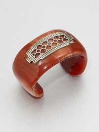 From the Dot Collection. This nature-inspired style from a socially and environmentally responsible brand features a stunning red agate cuff decorated with a delicate, sterling silver cutout center surrounded by a dotted 18k gold border. Red agateSterling silver18k goldDiameter, about 2.3Slip-on styleImported From the Dot Collection. This nature-inspired style from a socially and environmentally responsible brand features a stunning red agate cuff decorated with a delicate, sterling silver cutout center surrounded by a dotted 18k gold border. Red agateSterling silver18k goldDiameter, about 2.3Slip-on styleImported
