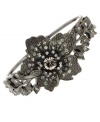 Floral fixation. A beautiful bloom is surrounded by sparkling crystals and glass accents on this eye-catching cuff bracelet from 2028. Crafted in hematite tone mixed metal. Approximate diameter: 2 inches.