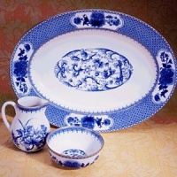 Edged in gold, this distinguished dinner service is based on a Chinese export porcelain pattern circa 1730 featuring a flowered medallion and floral sprays. Edged in gold, this distinguished dinner service is based on a Chinese export porcelain pattern circa 1730 featuring a flowered medallion and floral sprays.