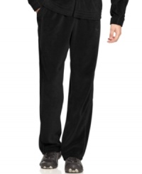 Make a run for it! You'll stay comfortable no matter what speed you're going in these velour track pants from Puma. Make a run for it! You'll stay comfortable no matter what speed you're going in these velour track pants from Puma.