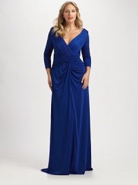 Divinely elegant, this stretch satin gown draws attention to the decolletage, and provides arm coverage. Pretty pleats, gathered details and a twisted front perfect the sultry hourglass silhouette.Deep v-necklineThree-quarter sleevesTwist-front detailPleat-adorned bodiceBack zipperFully linedAbout 45 from natural waist92% polyester/8% spandexDry cleanImported Divinely elegant, this stretch satin gown draws attention to the decolletage, and provides arm coverage. Pretty pleats, gathered details and a twisted front perfect the sultry hourglass silhouette.Deep v-necklineThree-quarter sleevesTwist-front detailPleat-adorned bodiceBack zipperFully linedAbout 45 from natural waist92% polyester/8% spandexDry cleanImported