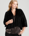 A chic topper for all your looks, this Tahari Woman Plus jackets flaunts a plus faux-fur outer for exotic attitude.