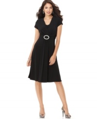 A beautiful embellished buckle lends low-key glam to this elegant draped cocktail dress from R&M Richards. A beautiful embellished buckle lends low-key glam to this elegant draped cocktail dress from R&M Richards.
