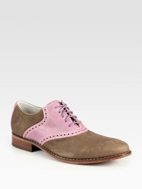 Vibrant, contrasting colors overtake this classic saddle shoe lending endless style possibilities.Leather upperLeather liningPadded insoleLeather/rubber soleImported Vibrant, contrasting colors overtake this classic saddle shoe lending endless style possibilities.Leather upperLeather liningPadded insoleLeather/rubber soleImported