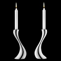 Georg Jensen Cobra candleholders in polished stainless steel. Designed by Constantin Wortmann, who took the familiar silhouette of the traditional candleholder and reinvigorated it with organic curves. It's snakelike strength is shared by its' name. Georg Jensen Cobra candleholders in polished stainless steel. Designed by Constantin Wortmann, who took the familiar silhouette of the traditional candleholder and reinvigorated it with organic curves. It's snakelike strength is shared by its' name.
