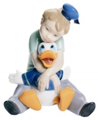 A childhood dream come true, this enchanting collectible depicts a young boy and Disney's Donald Duck in fine porcelain. From Nao by Lladro. A childhood dream come true, this enchanting collectible depicts a young boy and Disney's Donald Duck in fine porcelain. From Nao by Lladro.