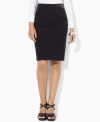 A heritage-inspired faux-leather buckle at the waist updates Lauren by Ralph Lauren's classic pencil skirt silhouette, crafted in sleek stretch twill. (Clearance)