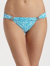 Smooth stretch knit features ocean inspired abstract graphics and silvertone bead accents.Mid-rise waistband Fold-over top with beaded accents Fully lined 85% Meryl nylon/15% spandex Fully lined Hand wash ImportedPlease note: Bikini top sold separately. Smooth stretch knit features ocean inspired abstract graphics and silvertone bead accents.Mid-rise waistband Fold-over top with beaded accents Fully lined 85% Meryl nylon/15% spandex Fully lined Hand wash ImportedPlease note: Bikini top sold separately.