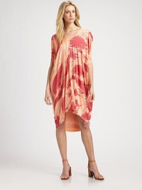 Vibrantly printed jersey in a caftan-inspired silhouette with an asymmetrical hi-low hem, short dolman sleeves and a plunging v-back. V-neckShort dolman sleevesAsymmetrical hi-low hemPlunging v-backAbout 28 from natural waist92% modal/8% spandexDry cleanMade in USAModel shown is 5'10 (177cm) wearing US size Small. Vibrantly printed jersey in a caftan-inspired silhouette with an asymmetrical hi-low hem, short dolman sleeves and a plunging v-back. V-neckShort dolman sleevesAsymmetrical hi-low hemPlunging v-backAbout 28 from natural waist92% modal/8% spandexDry cleanMade in USAModel shown is 5'10 (177cm) wearing US size Small.
