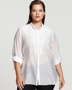 Intricate tonal embroidery covers the front of this effortlessly chic tunic from Tahari Woman. Pair with white trousers for a dramatic head-to-toe finish.