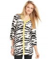This chic tunic from Alfani features a bold animal print that's highlighted by a flash of contrasting trim at the neck and center front.
