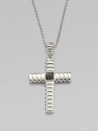 A polished cross pendant is suspended from a chain necklace, both crafted in sterling silver.From the Bedeg CollectionSterling silverPendant, 1¼W x 1½HNecklace, 24 lengthImported