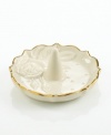 A single rose blossom and delicate dots carved in ivory porcelain make this classic ring holder a fine storage space for special jewelry. With a scalloped, gold-tipped rim.