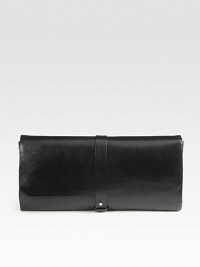A roomy flap-top design in ultra-rich Bovine leather is timeless and sophisticated. Strap and stud flap closureSide decorative snap closuresThree inside zip pocketsOne inner mirrorSuede lining14W X 7¼H X 1DMade in Italy A roomy flap-top design in ultra-rich Bovine leather is timeless and sophisticated. Strap and stud flap closureSide decorative snap closuresThree inside zip pocketsOne inner mirrorSuede lining14W X 7¼H X 1DMade in Italy
