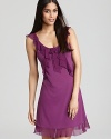 A sleeveless chemise with cascading ruffles along neckline and hem.