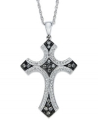 A stunning cross pendant with medieval flair. Set in sterling silver with touches of black rhodium, this cross glistens with the addition of round-cut diamonds (1/4 ct. t.w.). Approximate length: 18 inches. Approximate drop: 1-1/2 inches. A stunning cross pendant with medieval flair. Set in sterling silver with touches of black rhodium, this cross glistens with the addition of round-cut diamonds (1/4 ct. t.w.). Approximate length: 18 inches. Approximate drop: 1-1/2 inches.