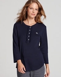 Lauren Ralph Lauren adds a feminine touch to this classic lounge top with a front ruffle and three-quarter sleeves. Lauren Ralph Lauren adds a feminine touch to this classic lounge top with a front ruffle and three-quarter sleeves.