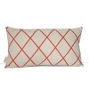Shimmering beads amidst an orange printed trellis dress up this decorative pillow.