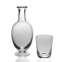 This elegant carafe and tumbler set from William Yeoward features a sophisticated spiral glass pattern. Makes a refined addition to your office or nightstand. This elegant carafe and tumbler set from William Yeoward features a sophisticated spiral glass pattern. Makes a refined addition to your office or nightstand.