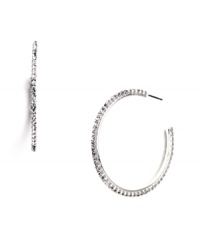 Polish your look with effortless sparkle. Nine West's three-quarter hoop earrings feature seamless sparkle in glass crystals. Crafted in silver tone mixed metal. Approximate diameter: 1-1/2 inches. Polish your look with effortless sparkle. Nine West's three-quarter hoop earrings feature seamless sparkle in glass crystals. Crafted in silver tone mixed metal. Approximate diameter: 1-1/2 inches.