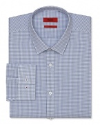 A slim fit HUGO dress shirt touts a plaid pattern and traditional barrel cuffs for streamlined office polish.
