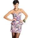 Material Girl accents a femme, floral-print peplum dress with dark straps and an exposed zipper at the back.