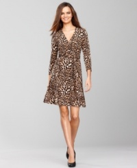 So fabulous! INC's petite wrap dress features a bold animal print and styling that works for day or night.