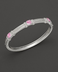 Intricately textured silver provides a dramatic backdrop for three cushion cut pink corundums. By Judith Ripka. Intricately textured silver provides a dramatic backdrop for three cushion cut pink corundums. By Judith Ripka.