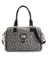 Stay chic with a classic signature style from Calvin Klein. This go-anywhere satchel is graced with a signature charm at front, an all-over logo print and optional crossbody strap. Stay chic with a classic signature style from Calvin Klein. This go-anywhere satchel is graced with a signature charm at front, an all-over logo print and optional crossbody strap.