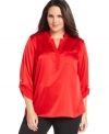 Dress up your casual bottoms with Calvin Klein's roll-tab sleeve plus size top.