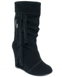 Fringe accents make the Carousel wedge booties by Kelsi Dagger a cool-weather must-have. Fringe accents make the Carousel wedge booties by Kelsi Dagger a cool-weather must-have.