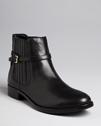 These IVANKA TRUMP Chelsea booties are a feminine version of the trend, with covered side panels and delicate ankle buckles. These IVANKA TRUMP Chelsea booties are a feminine version of the trend, with covered side panels and delicate ankle buckles.