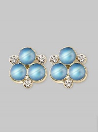 The lovely iridescence of cabochon moonstones, clustered amid diamond accents, gives these delicate earrings the feeling of being lit from within. Diamonds, 0.18 tcw Moonstone 18k yellow gold Length, about ½ Post back Made in Italy