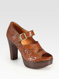 A summer staple of crocodile-embossed leather and goldtone hardware on a wooden stacked heel and platform. Stacked wooden heel, 4 (100mm)Stacked wooden platform, 1¼ (30mm)Compares to a 2¾ heel (70mm)Crocodile-embossed leather upperAdjustable ankle strapLeather liningLeather sole with rubber insertPadded insoleMade in Spain A summer staple of crocodile-embossed leather and goldtone hardware on a wooden stacked heel and platform. Stacked wooden heel, 4 (100mm)Stacked wooden platform, 1¼ (30mm)Compares to a 2¾ heel (70mm)Crocodile-embossed leather upperAdjustable ankle strapLeather liningLeather sole with rubber insertPadded insoleMade in Spain