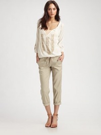 Pair this delicately embroidered cotton staple with flared jeans and chunky wedges for a hippie-chic ensemble that's bound to turn heads. V-neck with self tiesThree-quarter bishop sleevesElasticized hemCottonHand washImportedModel shown is 5'10 (177cm) wearing US size Small. Pair this delicately embroidered cotton staple with flared jeans and chunky wedges for a hippie-chic ensemble that's bound to turn heads. V-neck with self tiesThree-quarter bishop sleevesElasticized hemCottonHand washImportedModel shown is 5'10 (177cm) wearing US size Small.