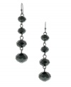 A refined line: With their long, lean silhouette, 2028's linear drop earrings epitomize elegance. Crafted in hematite tone mixed metal with black plastic beads. Approximate drop: 2 inches.