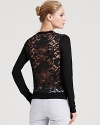 Wow them in this deceptively-tame Theory sweater that reveals a simple solid front and flaunts a sheer lace back.