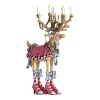 Donner simply saw herself as Donna the minute she pulled on those tall pink boots-even tiny reindeer can be fickle. Festive wreaths and bright candles complete her look.