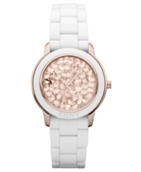 Glistening rosy crystals create a captivating appearance on this DKNY watch. Glistening rosy crystals create a captivating appearance on this DKNY watch.