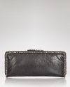 Edgy detailing meets an evening shape on this Clara Kasavina clutch. Gritty and pretty at once, its a match for an army jacket and a model-off-duty attitude.