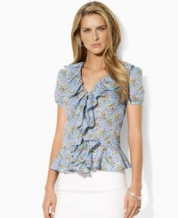 The ethereal Lauren Jeans Co. blouse is designed in breezy, slightly sheer cotton with frothy ruffles and a delicate floral pattern for modern romance. The ethereal Lauren Jeans Co. blouse is designed in breezy, slightly sheer cotton with frothy ruffles and a delicate floral pattern for modern romance.