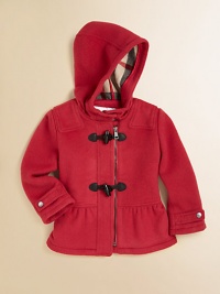 An ultra-toasty wool coat with toggle buttons, attached hood, check lining and pretty peplum hem for your little snow bunny.Attached hood with button closureShoulder patchesLong sleeves with snap cuffsFront zip with toggle buttonsPeplum hemFully linedWoolDry cleanImported