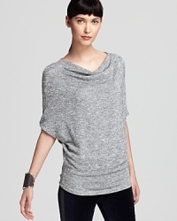 Replete with shimmering Lurex thread for allover silver sparkle, this party-poised Velvet by Graham & Spencer top flaunts chic dolman sleeves with a classic cowl neck. Replete with shimmering Lurex thread for allover silver sparkle, this party-poised Velvet by Graham & Spencer top flaunts chic dolman sleeves with a classic cowl neck.