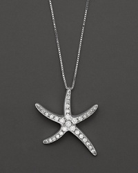 Gracefully undulating starfish pendant necklace with pave diamond clusters.